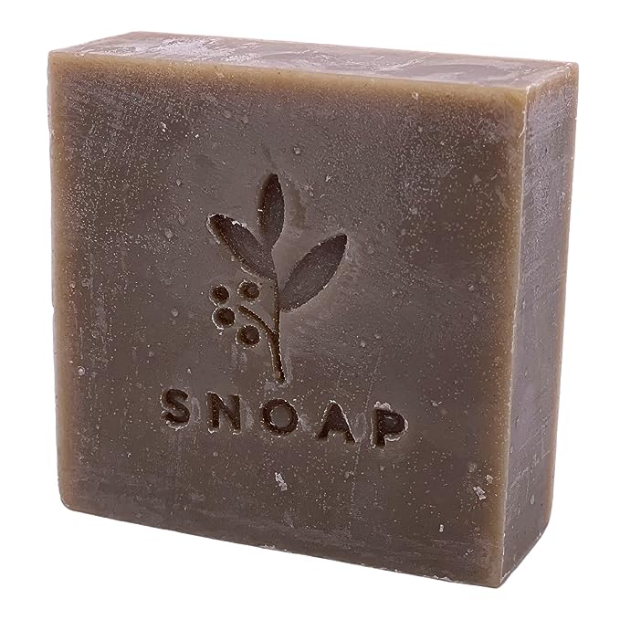 The image shows a bar of soap called "Snoap dead sea mud soap" from the left side to front.