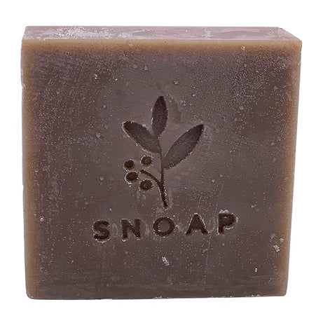 The image shows a bar of soap called "Snoap dead sea mud soap" from the front side.