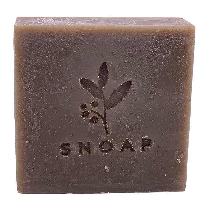 The image shows a bar of soap called "Snoap dead sea mud soap" from the front side.