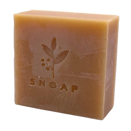 The image shows a bar of soap called "Snoap tea tree soap" from the left side to front.